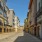 wide driveway flanked by apartments